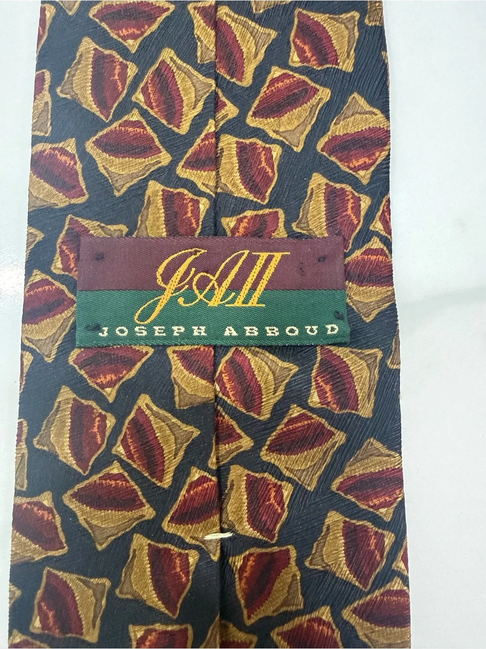 Joseph Abboud Black Silk Tie with Red & Gold Geometric Motif